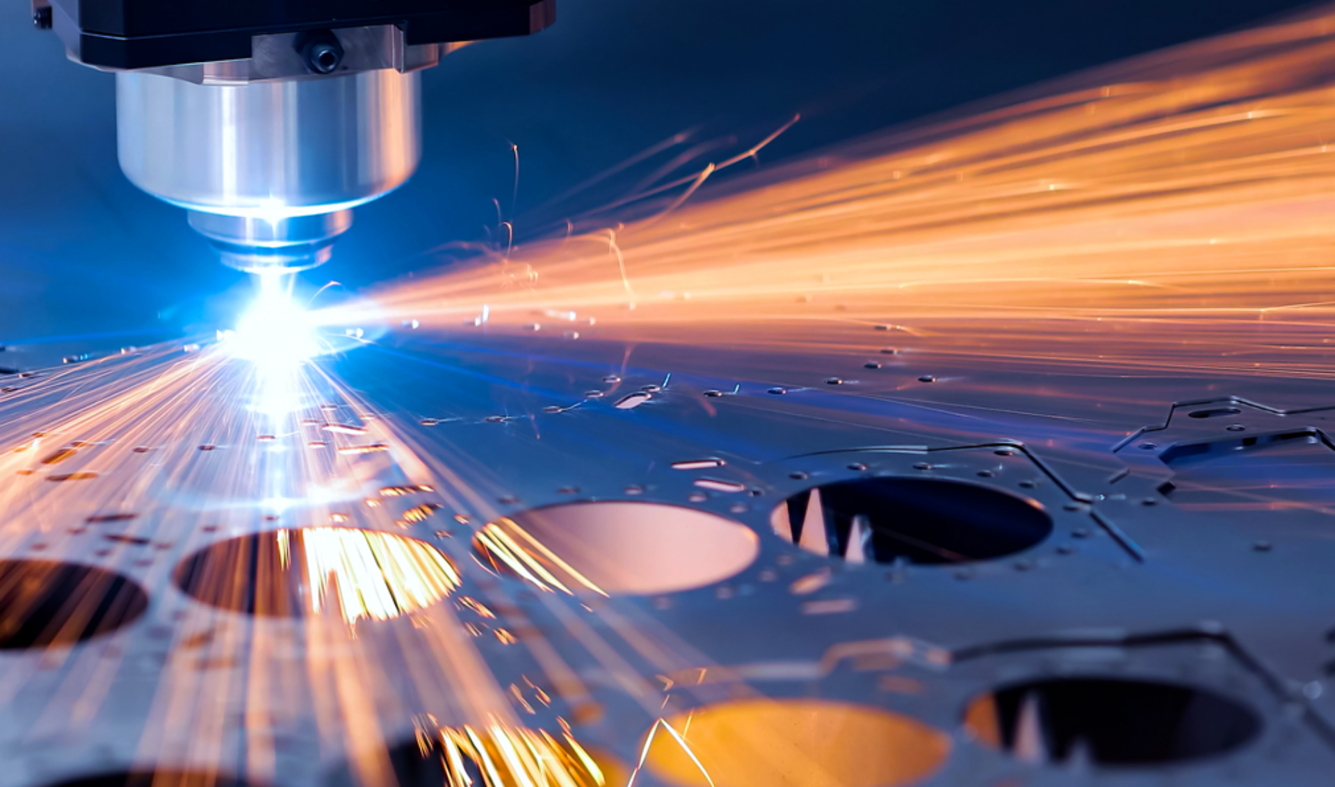 A laser cutting machine operates, precisely cutting through a sheet of metal in a workshop setting.