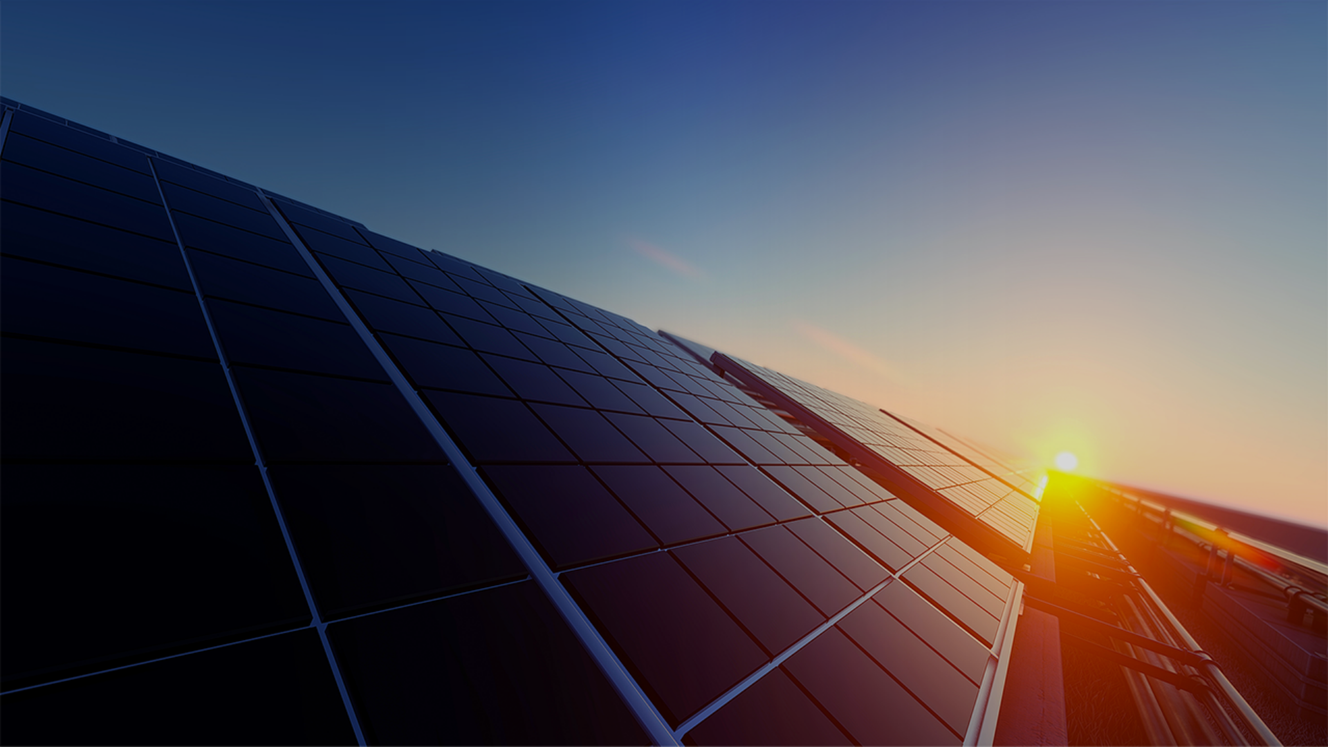 A rooftop adorned with solar panels, set against a vibrant sunset sky, highlighting sustainable energy solutions.
