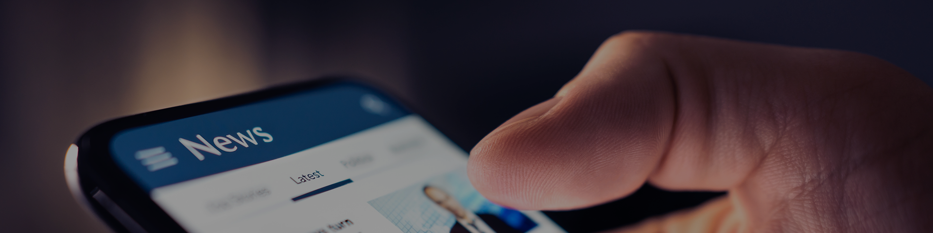 User interacting with a news application on their mobile device