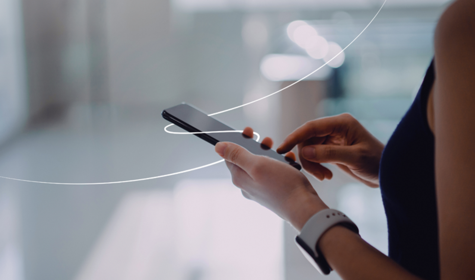 A woman grips a smartphone, with a circular border around it, highlighting the technology in her hand.