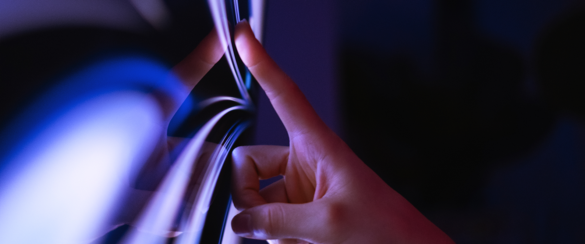 A close-up of the interaction between a person using a touch screen display.