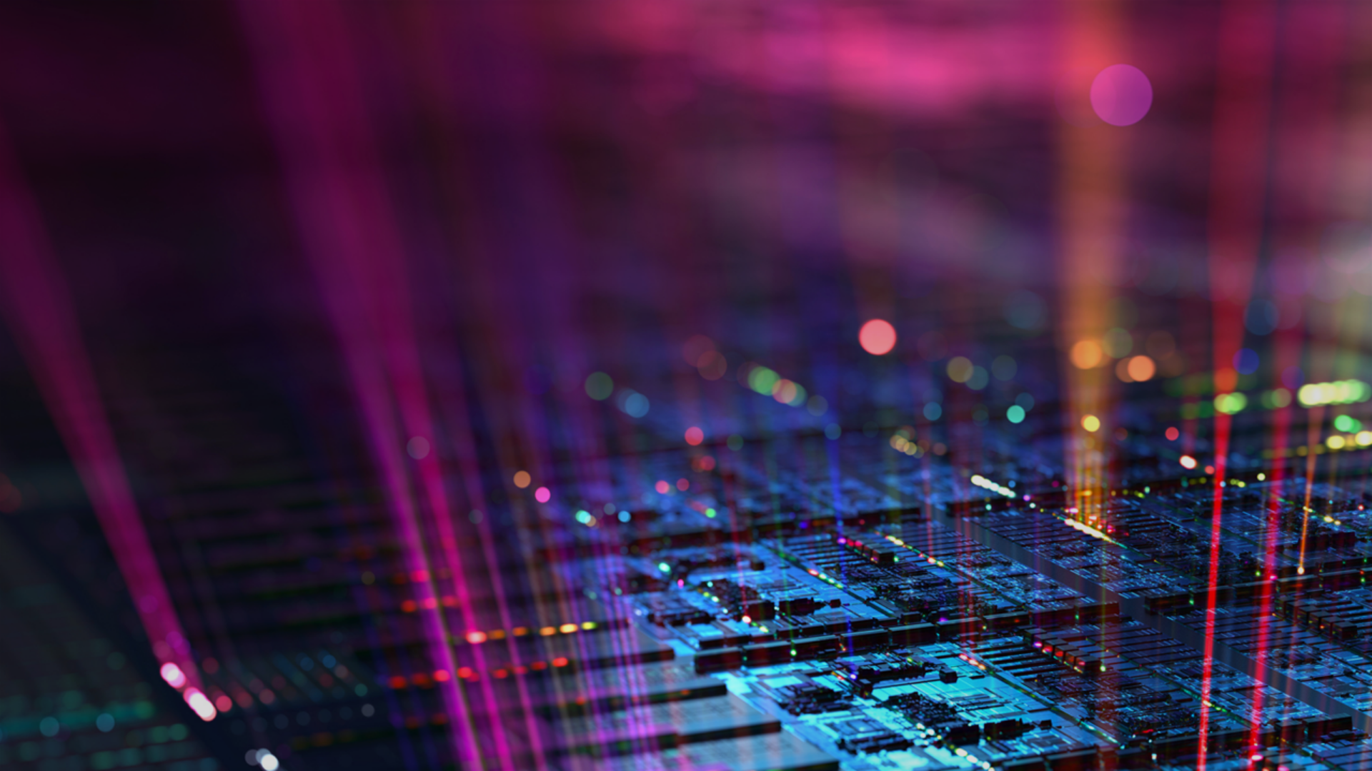 A close-up of a computer chip illuminated by vibrant, colorful lights, showcasing intricate circuitry and design.