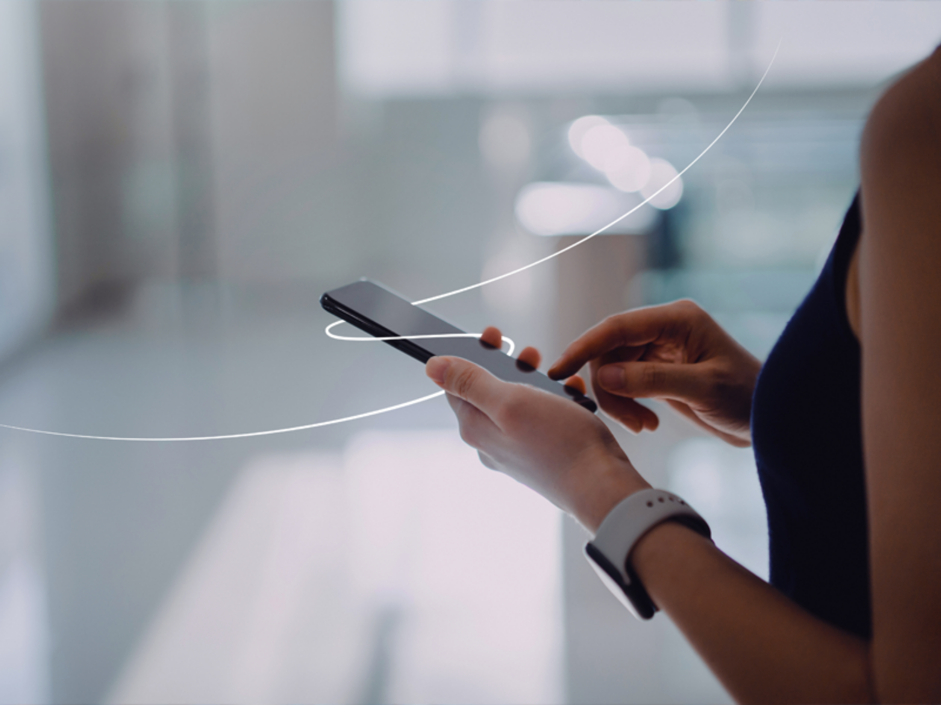 A woman grips a smartphone, with a circular border around it, highlighting the technology in her hand.